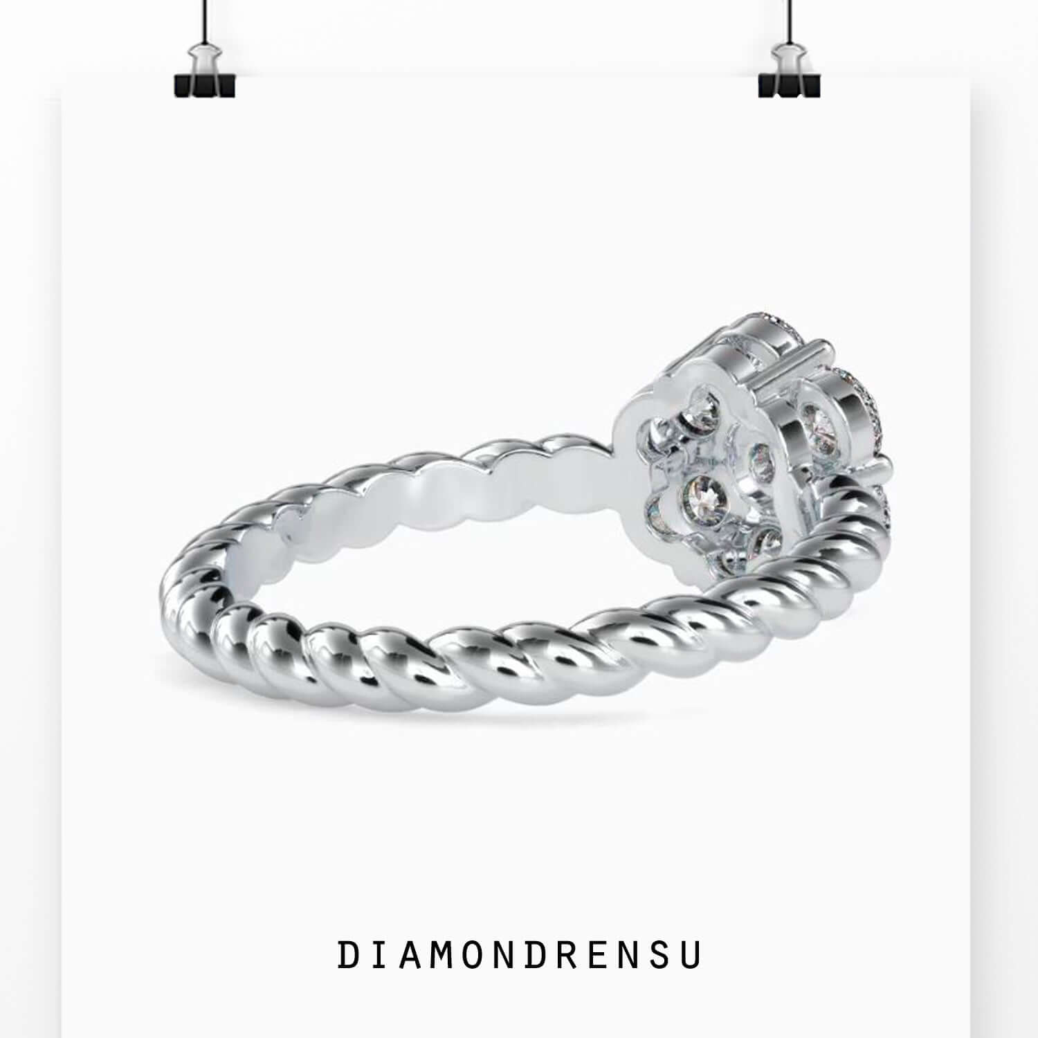 Custom engagement ring with cluster halo and twisted rope detail.
