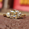 3 stone engagement ring featuring a cushion old mine cut center stone and round old European side stones.
