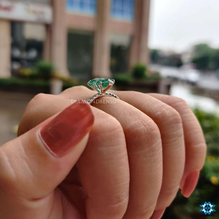Buy moissanite ring with green pear shaped center.