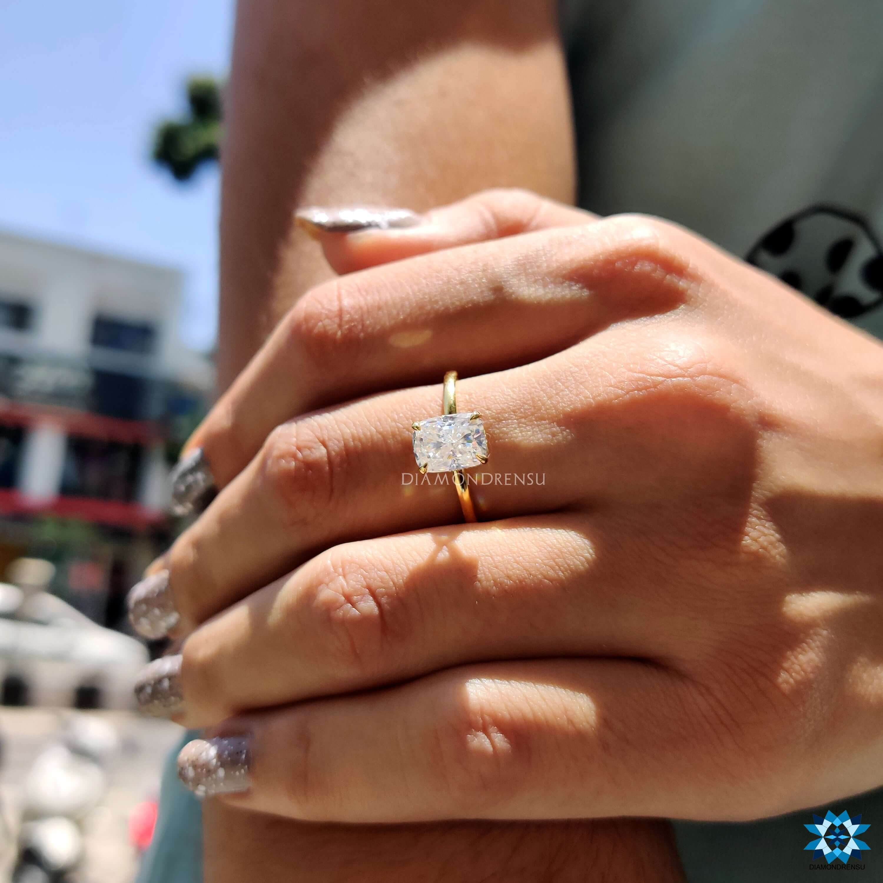 White gold engagement ring with elongated cushion moissanite.
