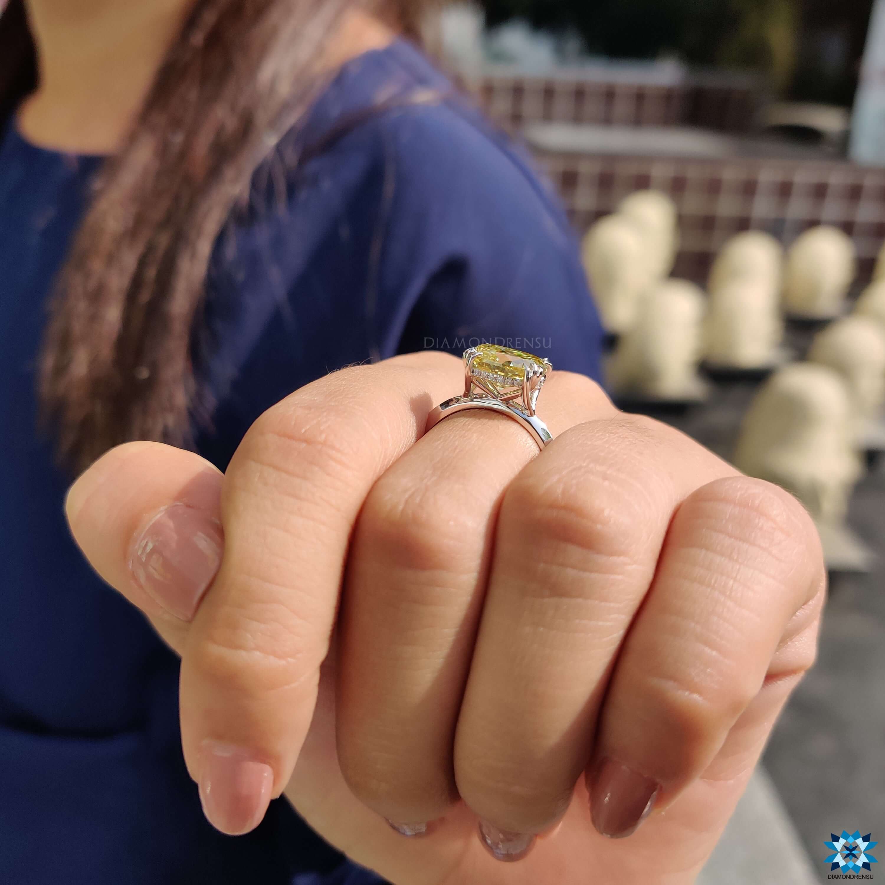 Handmade moissanite ring with yellow cushion cut stone.