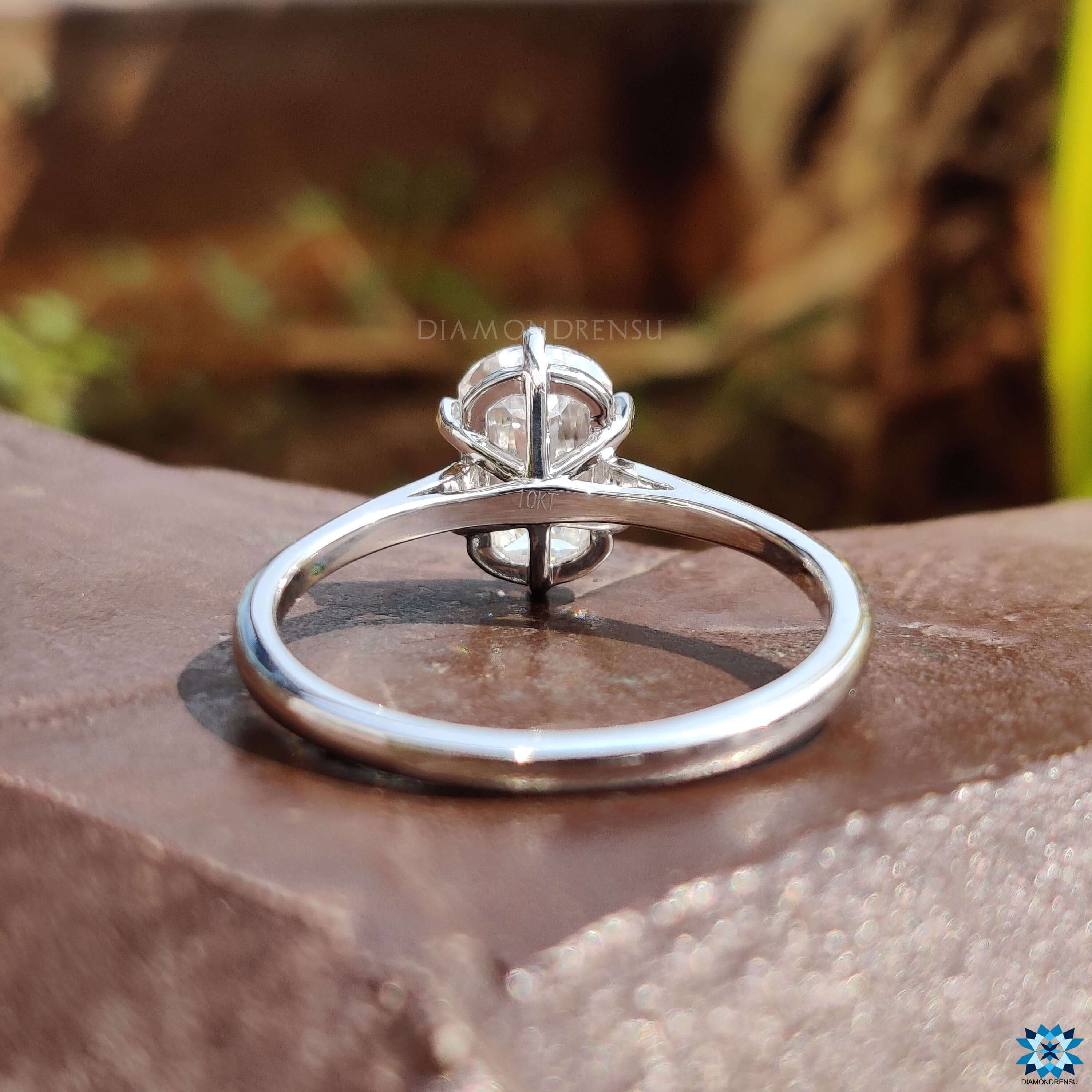 Moissanite solitaire ring with cathedral setting.