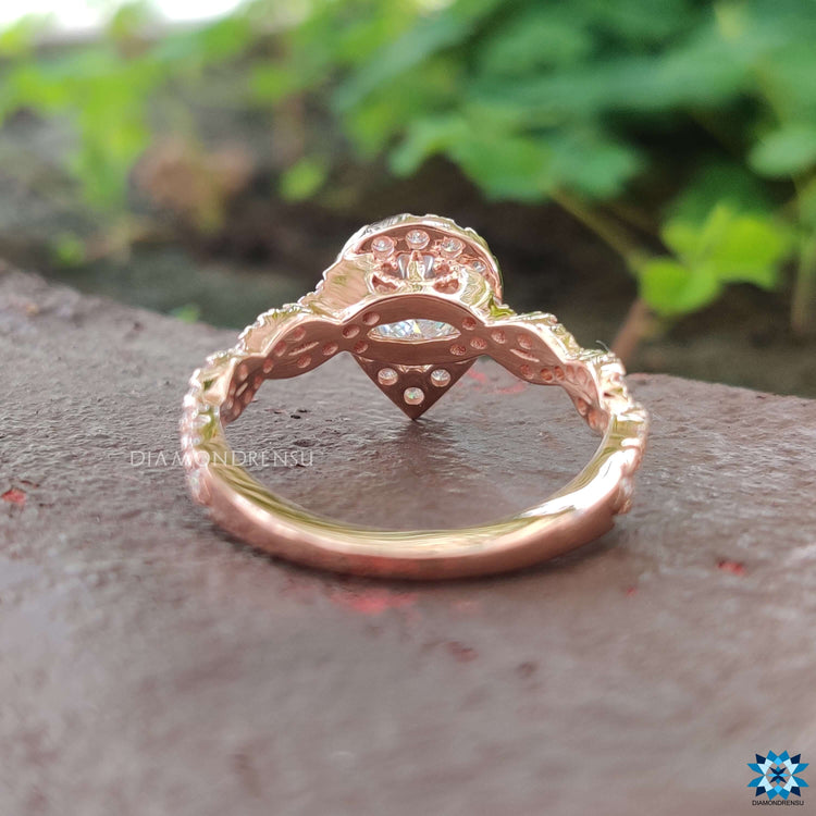 Custom pear cut engagement ring in rose gold.