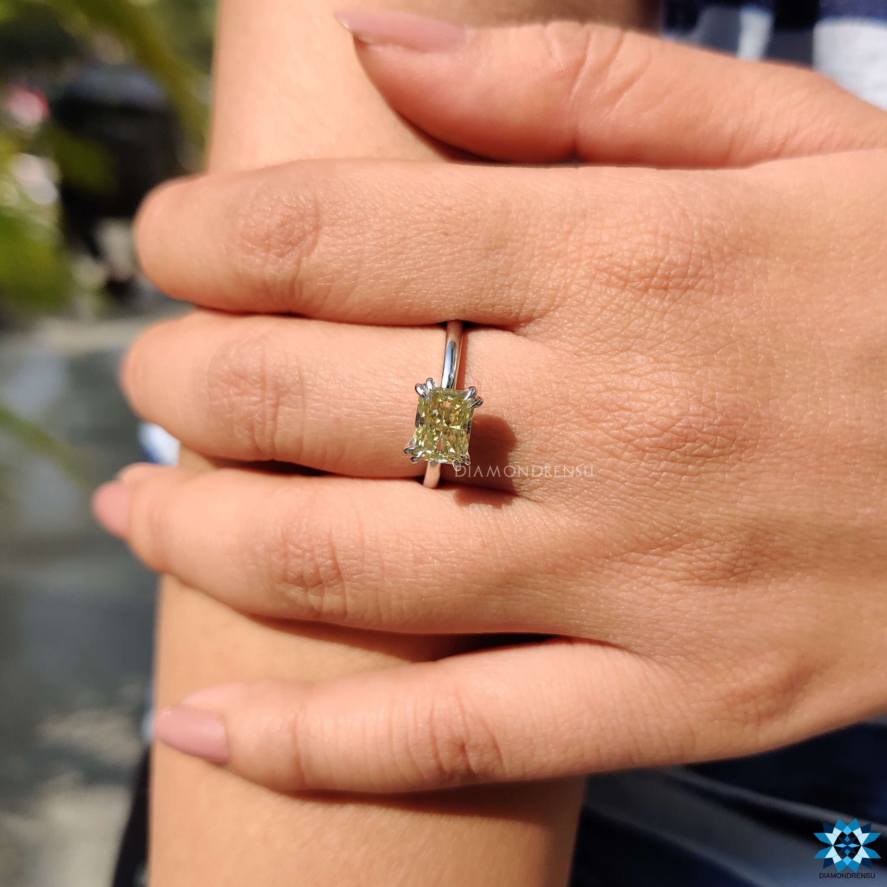 East west style moissanite ring in white gold.