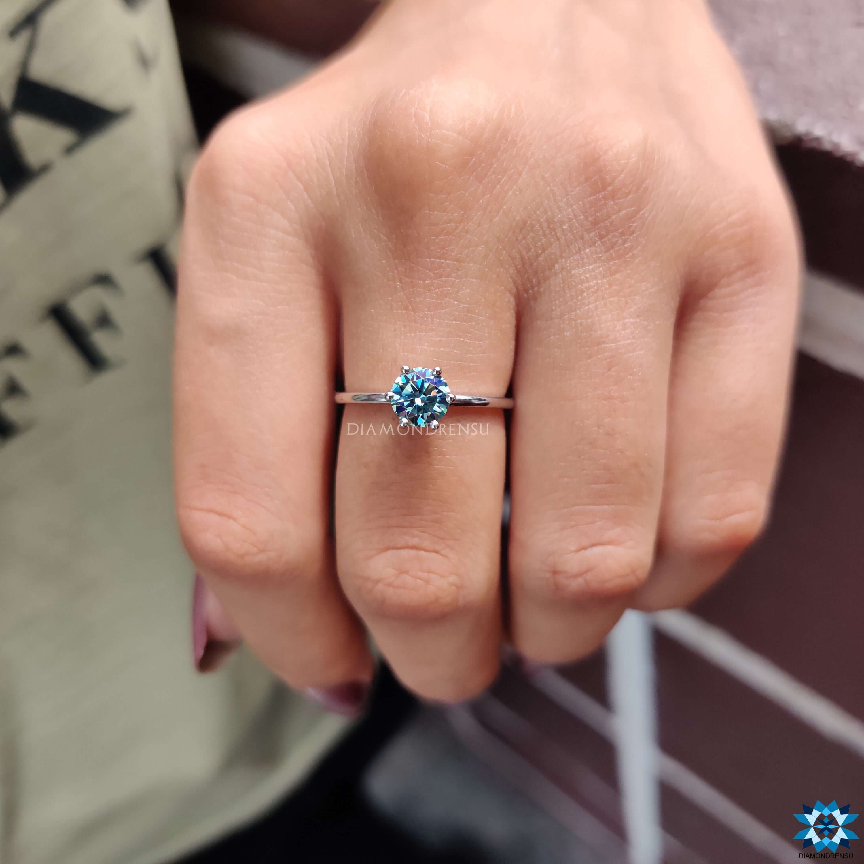 Round cut moissanite ring with six prong setting.