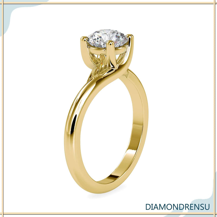 Handmade ring with round cut diamond and solitaire mount.