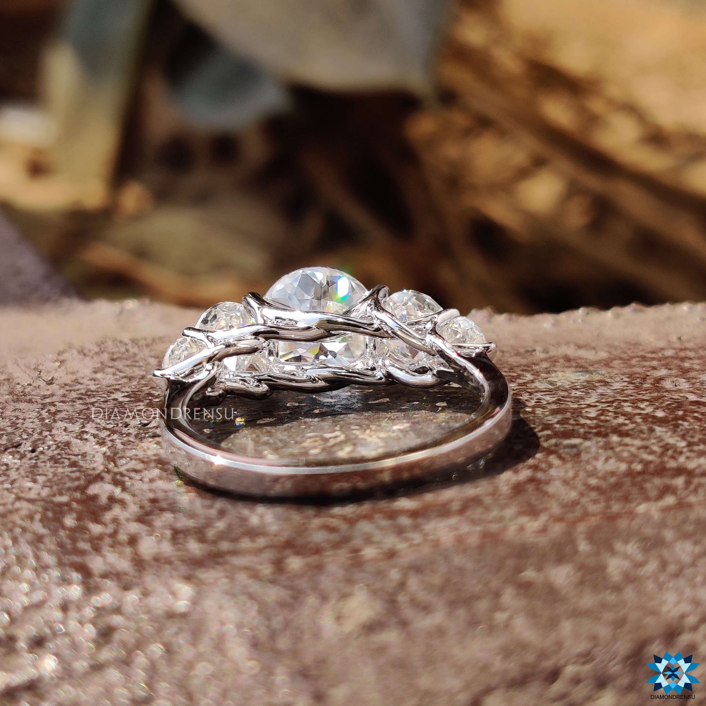 Handmade moissanite ring with jubilee center and side stones.