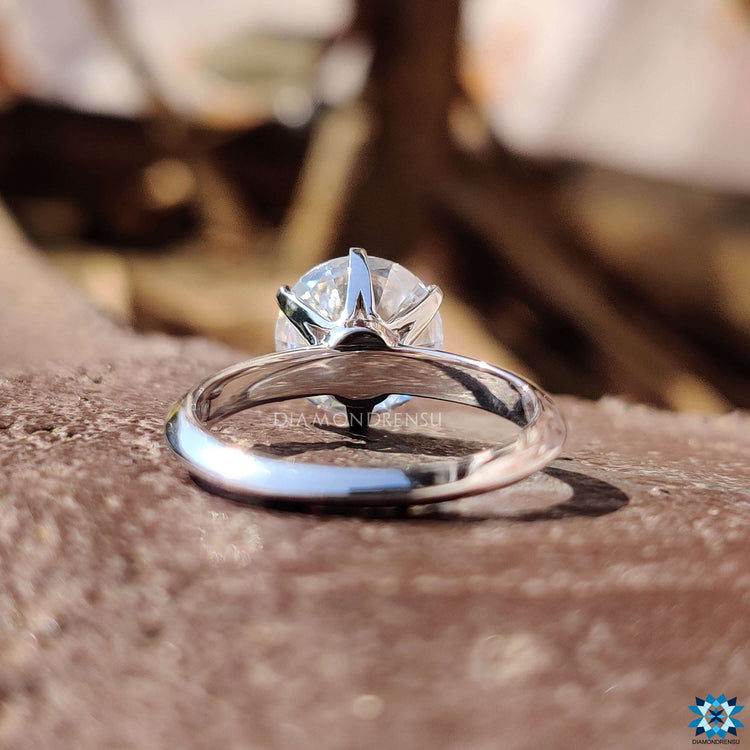 Prong setting round moissanite engagement ring.