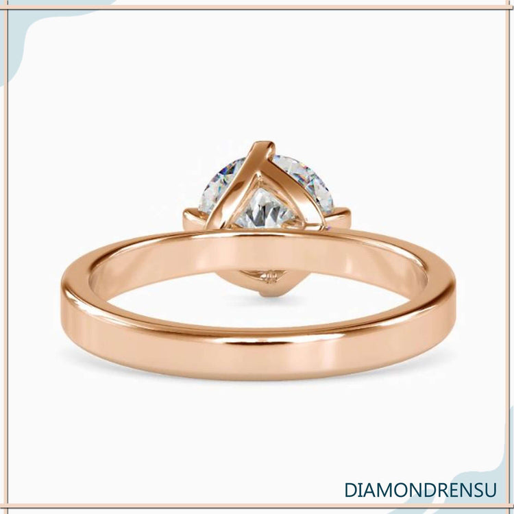 Handmade jewellery ring with round diamond in 4 prong style.