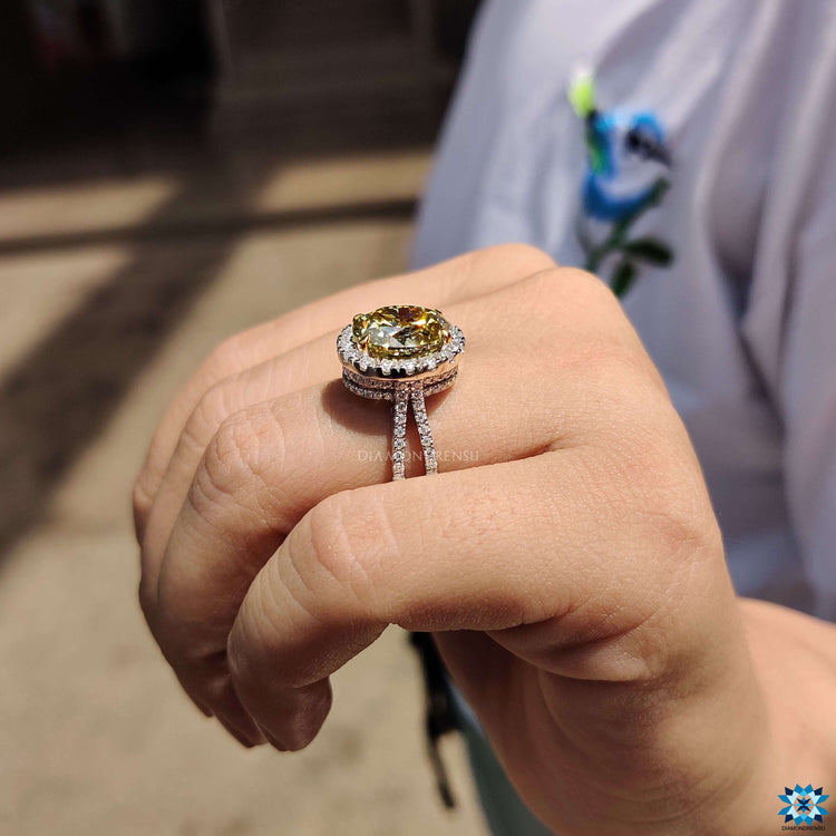 Canary yellow oval moissanite surrounded by hidden halo design.
