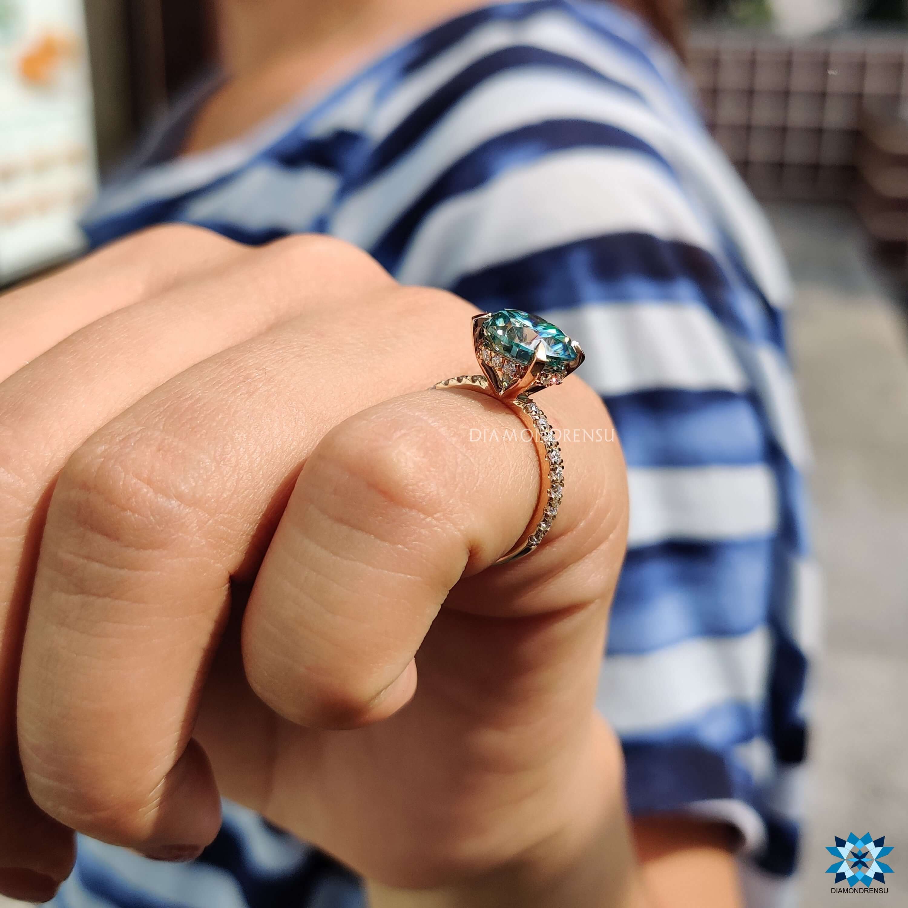 Diamondrensu UK rose gold hidden halo engagement ring.
