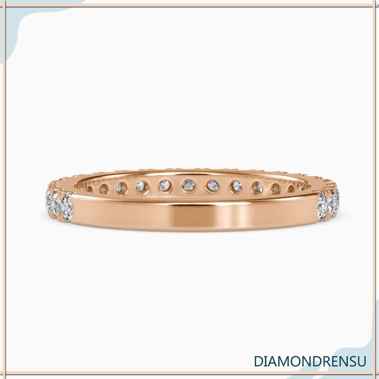 White gold wedding band with half eternity lab diamonds.