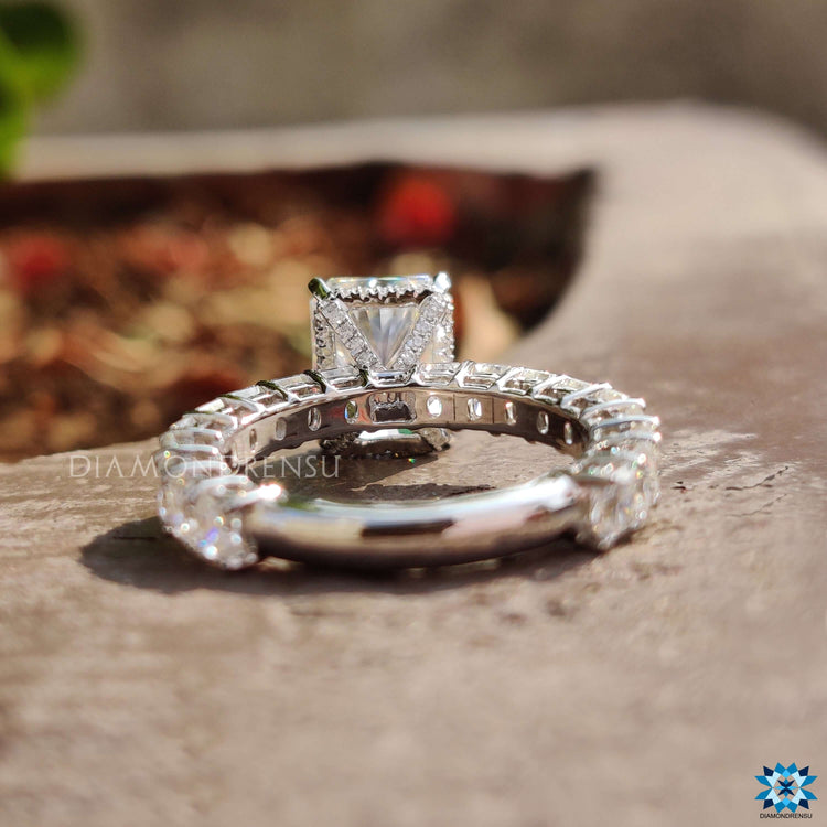 Radiant cut pave band ring in white gold.