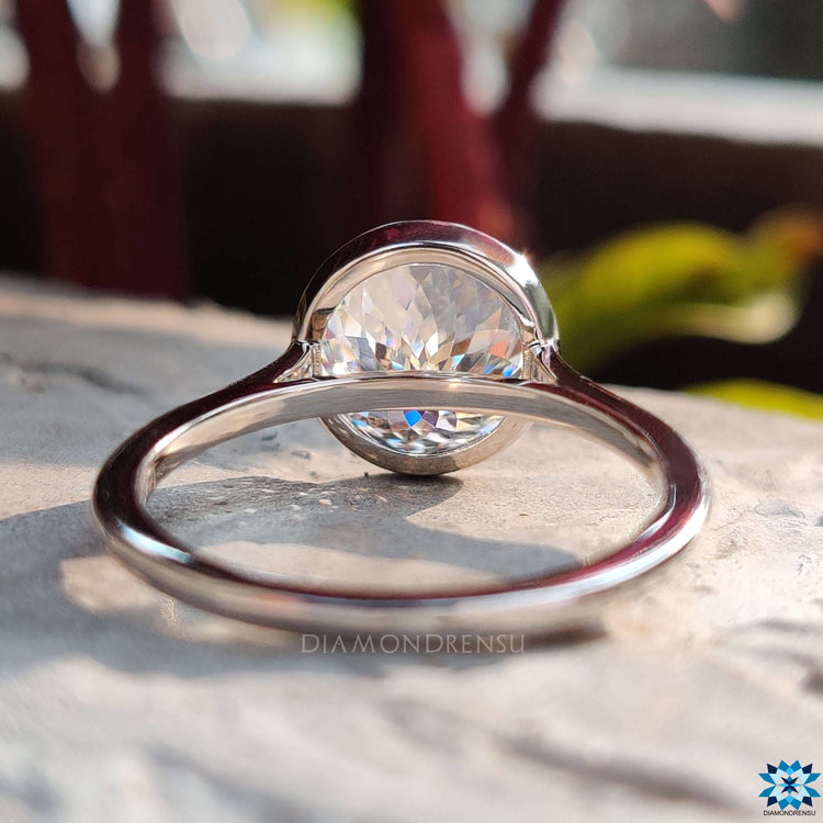 Custom moissanite ring with Portuguese cut in white gold.