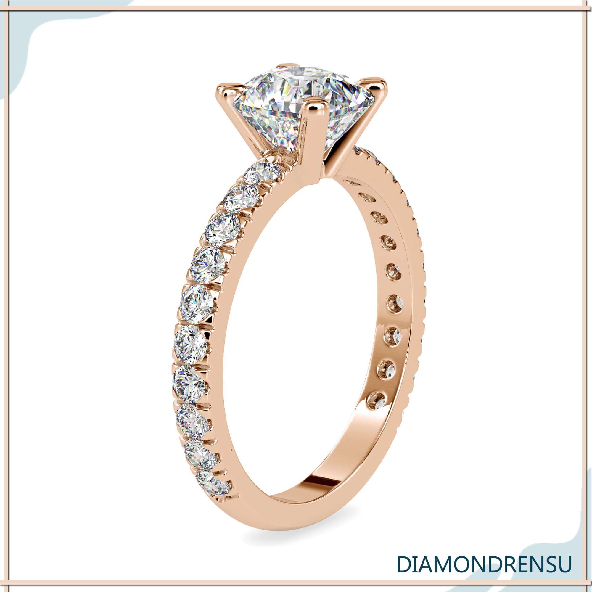 Rose gold engagement ring with handmade pave design.