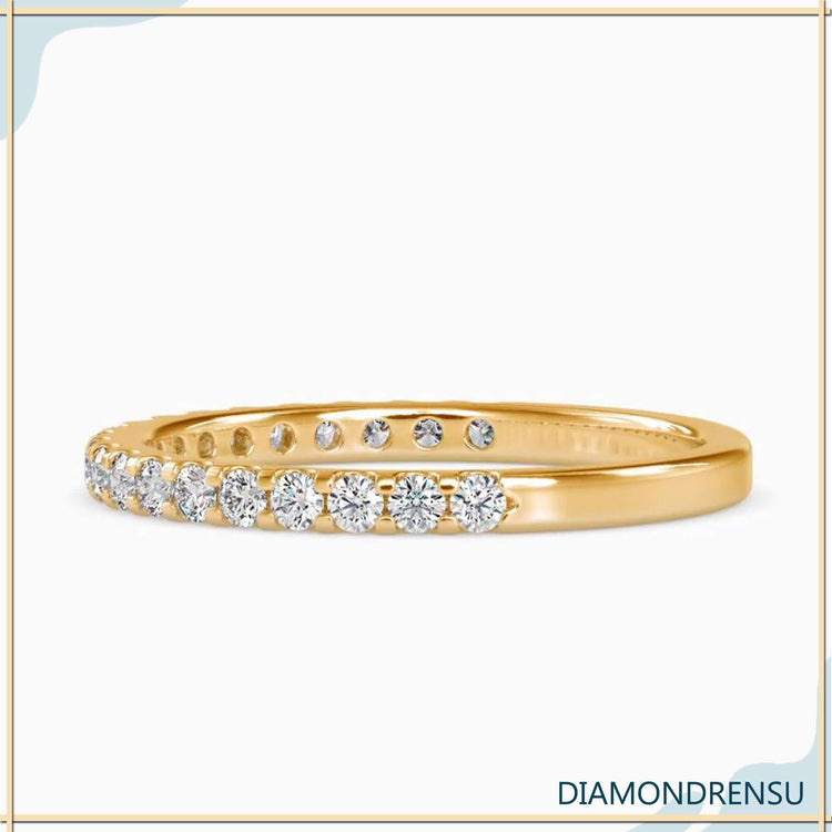 Custom round diamond wedding band in yellow gold.