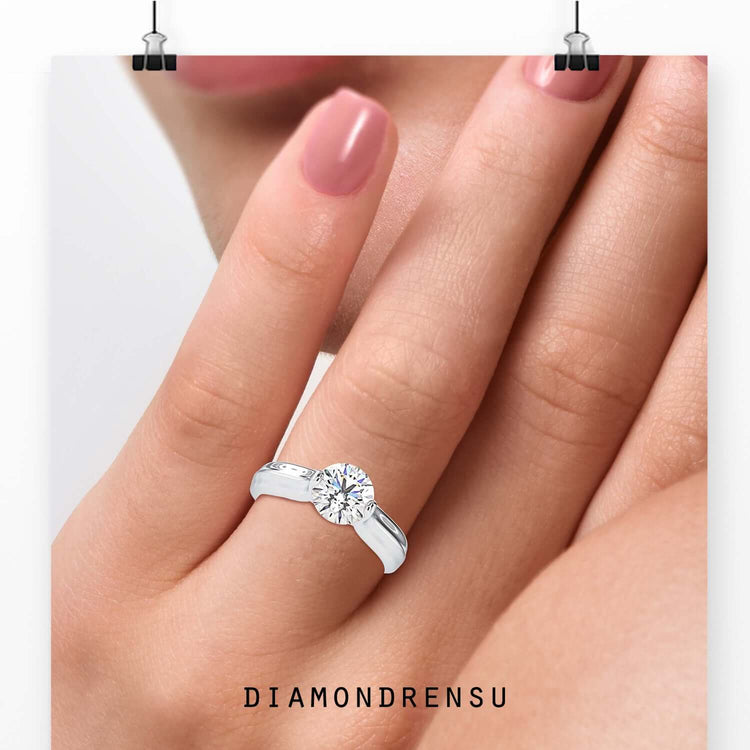 Round diamond ring in tension set solitaire style, IGI certified.
