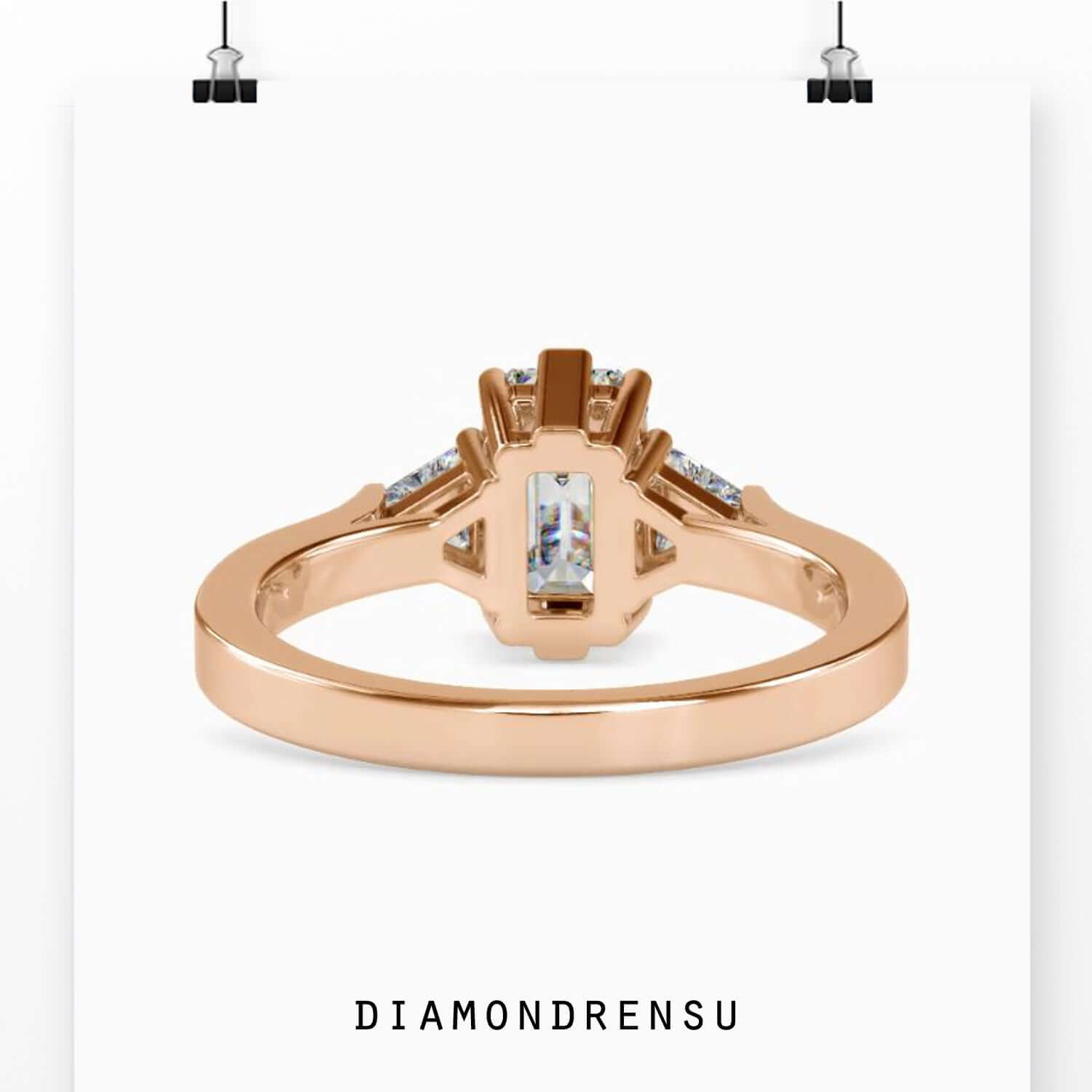 Diamondrensu UK ring with emerald cut centre diamond.