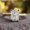 Elongated cushion cut moissanite engagement ring in a classic solitaire design.