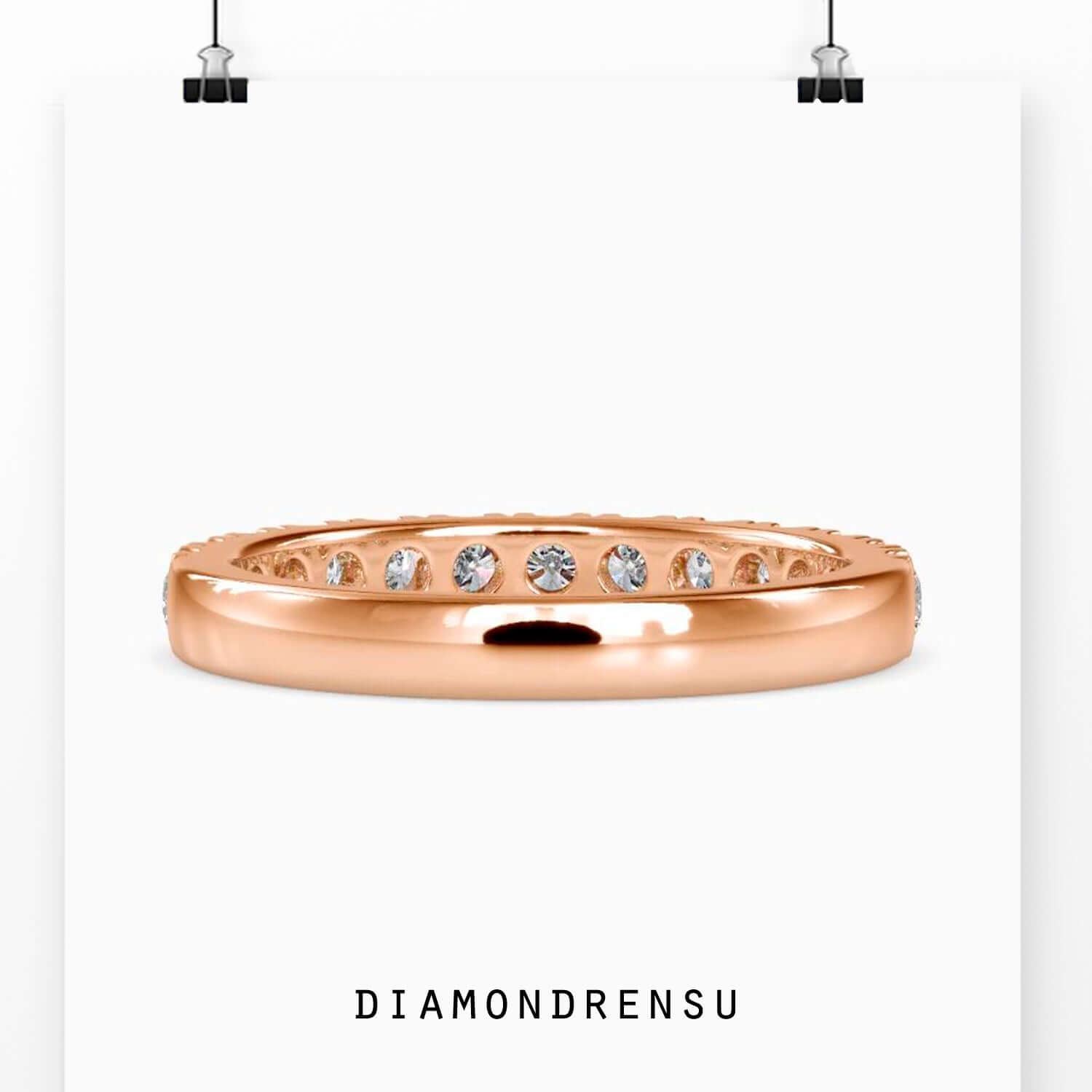 White gold wedding band with round cut diamonds.
