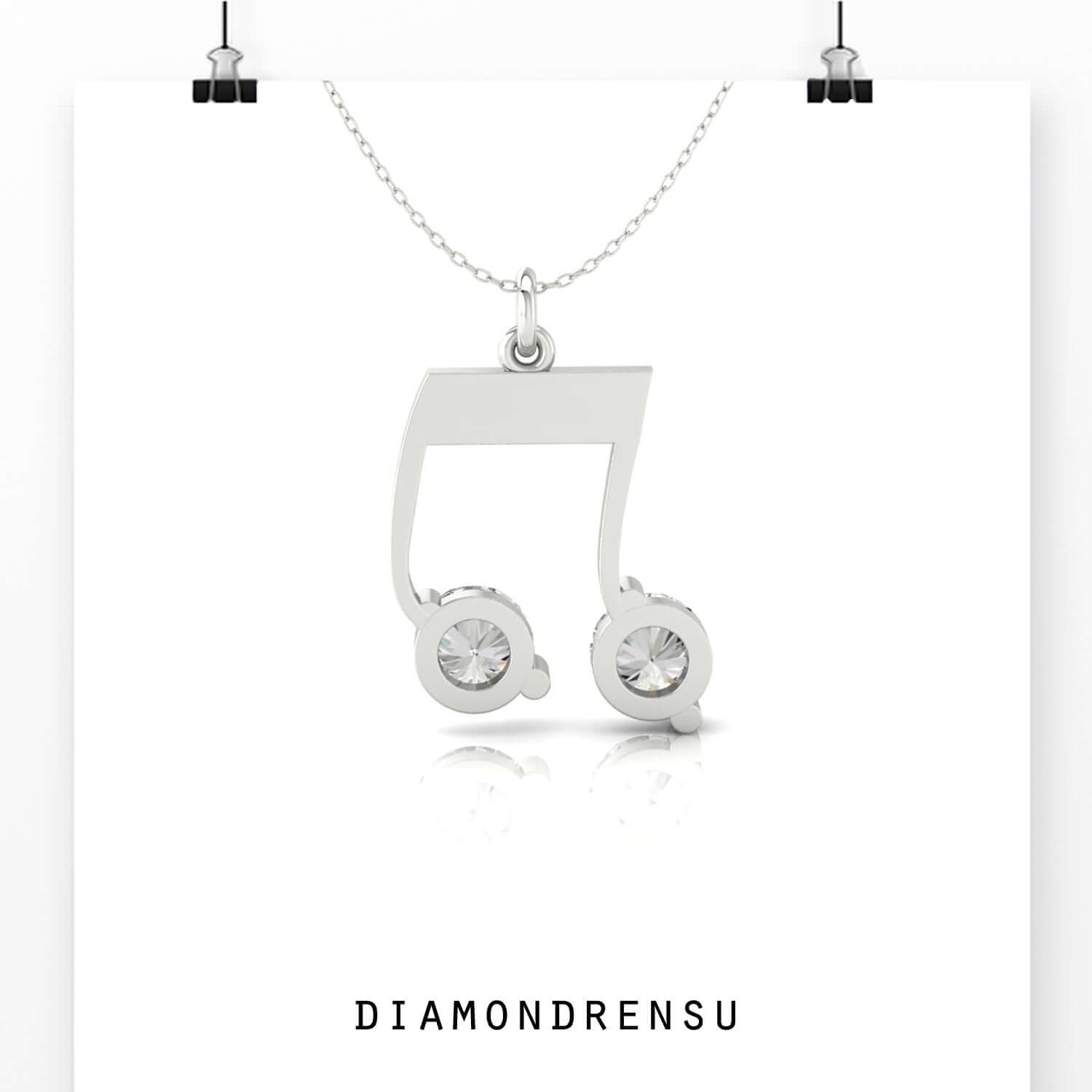 Handmade jewellery pendant with musical note charm in rose gold.