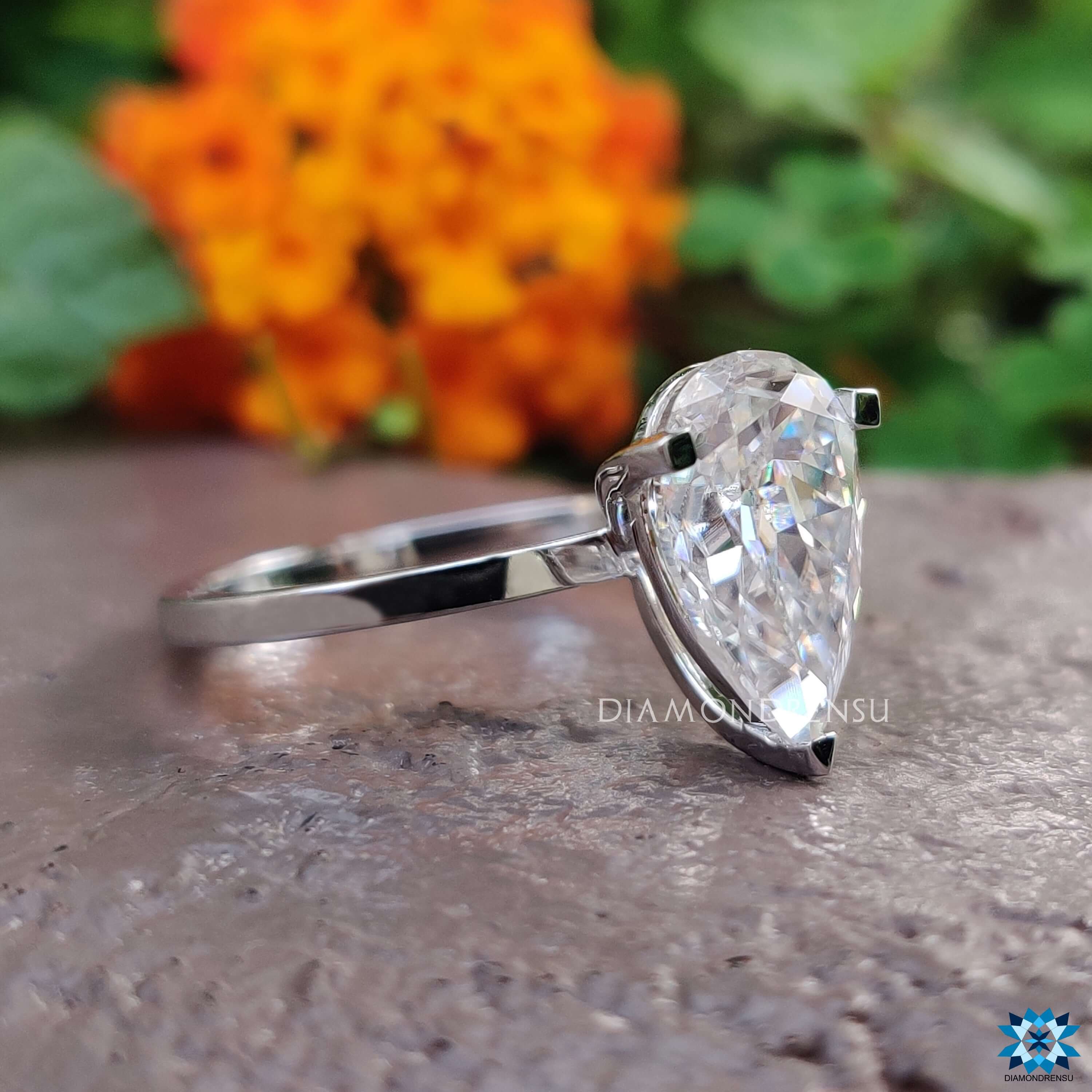 Diamondrensu UK pear moissanite solitaire engagement ring.