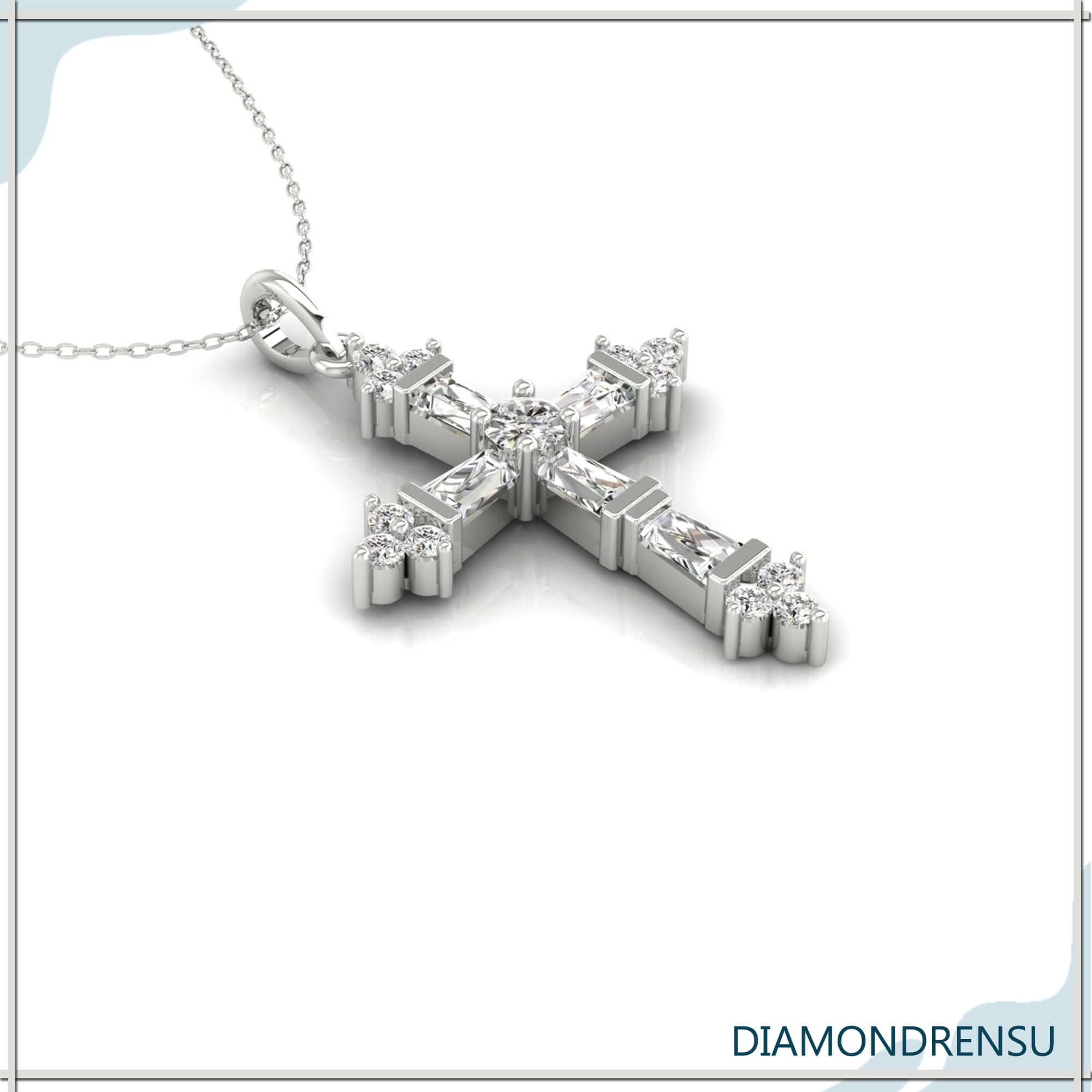 Tapered baguette diamond pendant in yellow gold cross design.