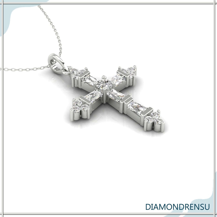 Tapered baguette diamond pendant in yellow gold cross design.