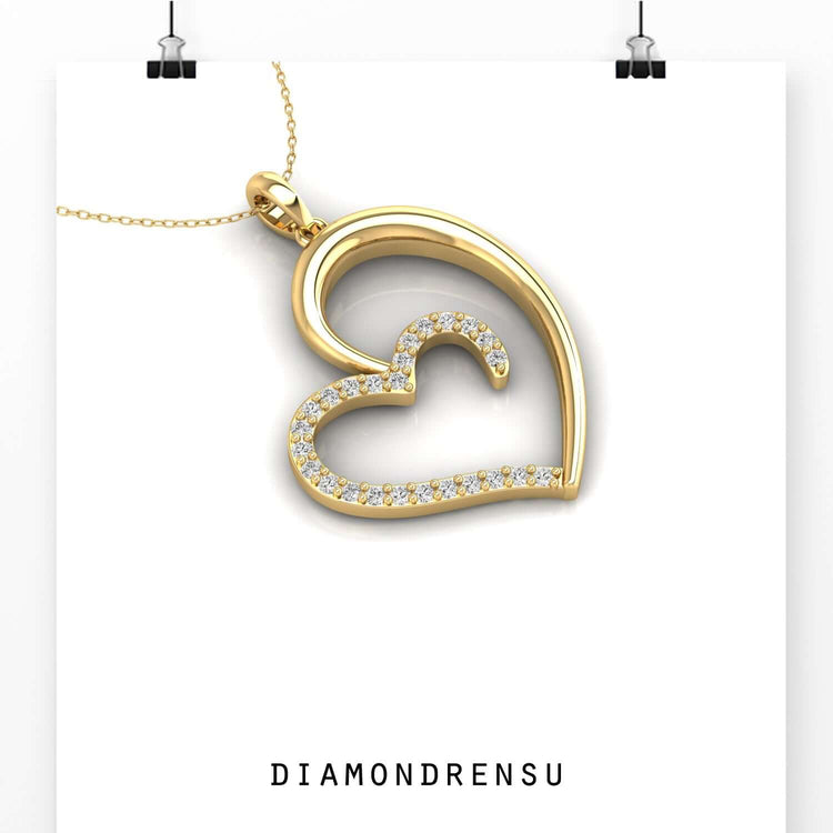 Shared prong setting heart pendant in rose gold style.