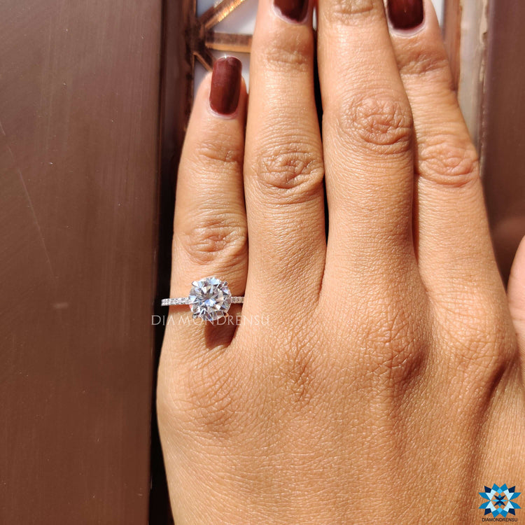 Buy custom round cut moissanite engagement ring.