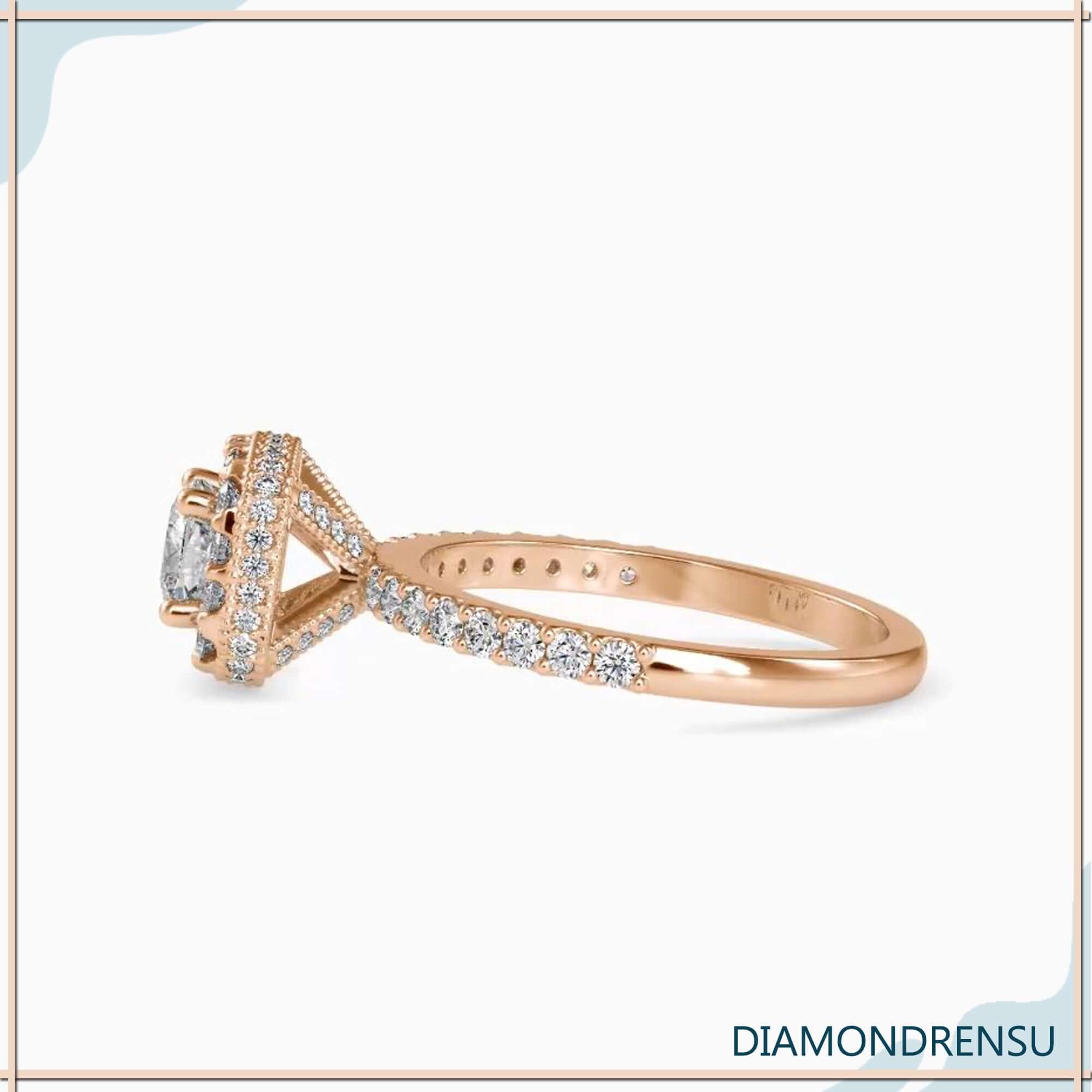Cushion diamond centre stone in white gold four prong setting.