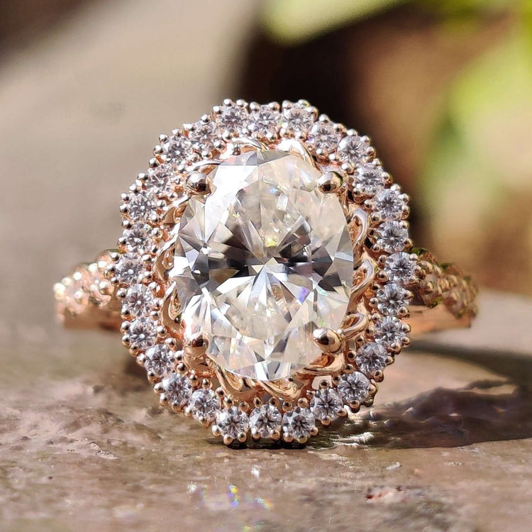 Oval engagement ring with round cut halo setting.