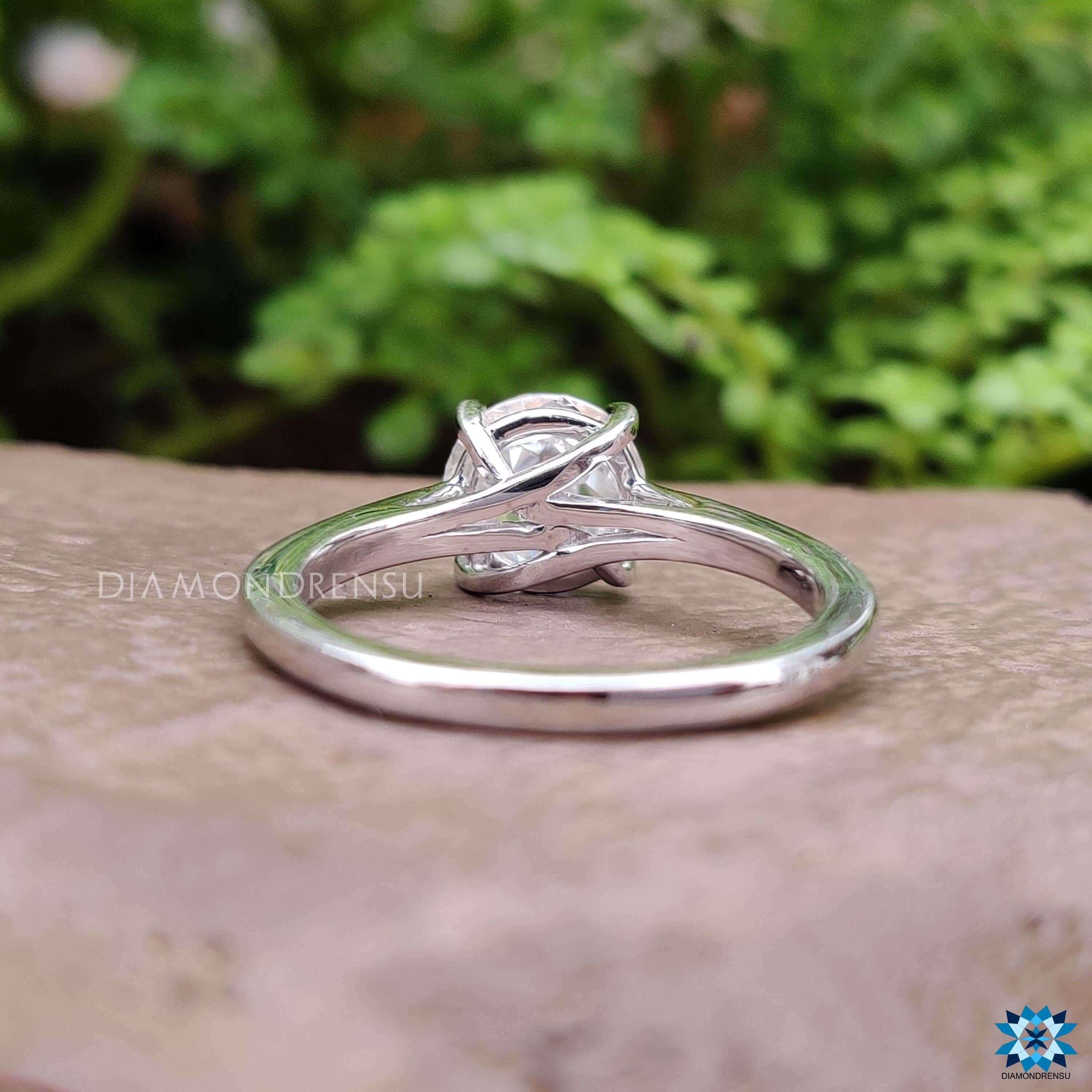 Custom white gold ring with prong setting and moissanite center.