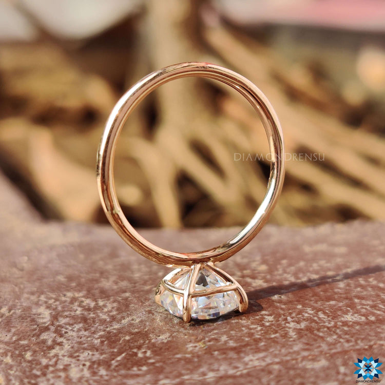 Handmade jewellery piece with cushion Rensu cut moissanite at the center.