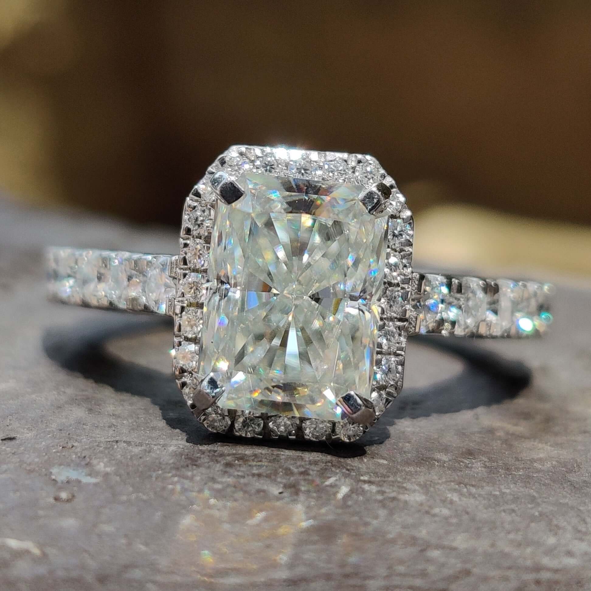 Radiant cut engagement ring with halo and hidden halo design.