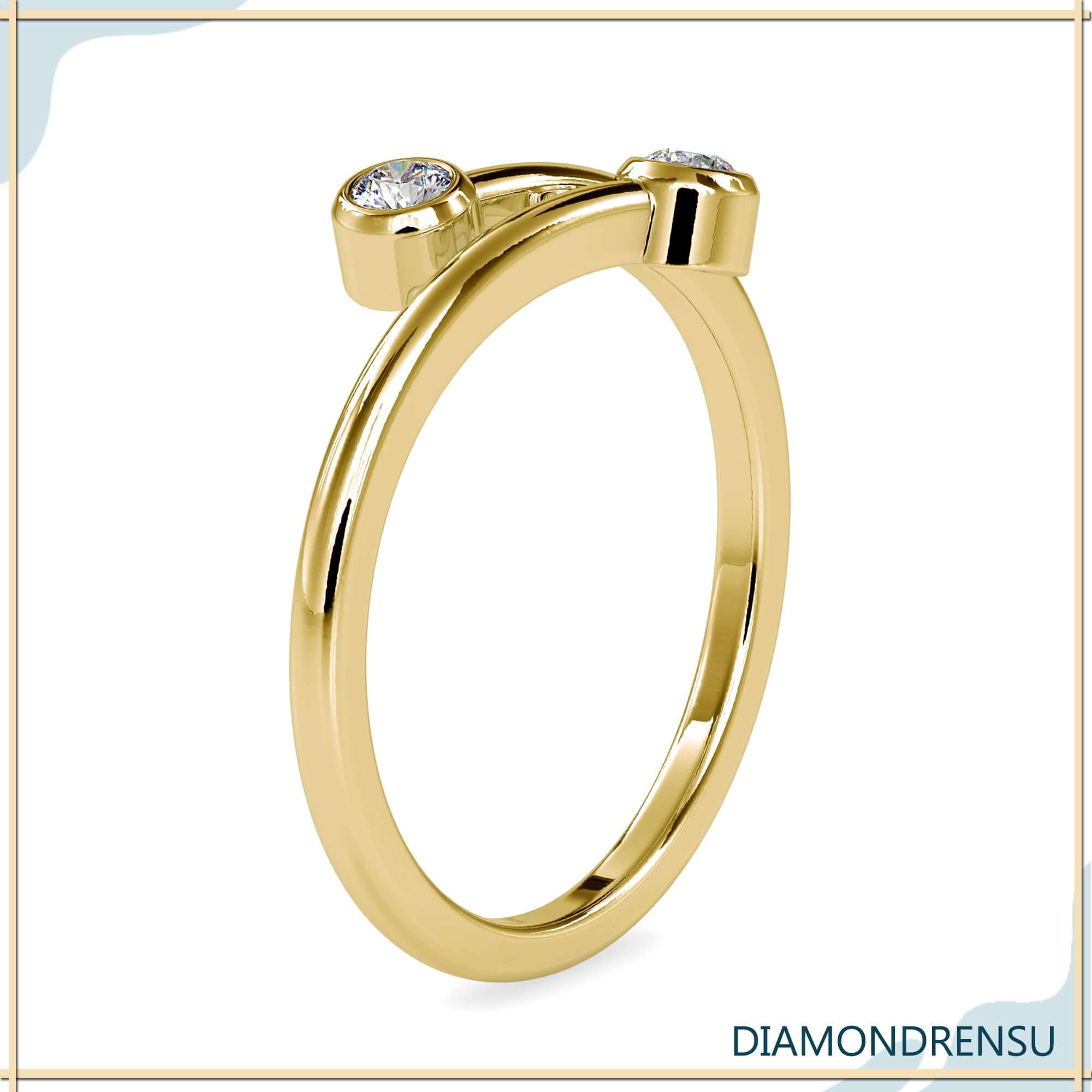 Bypass diamond band with two round cut lab stones.