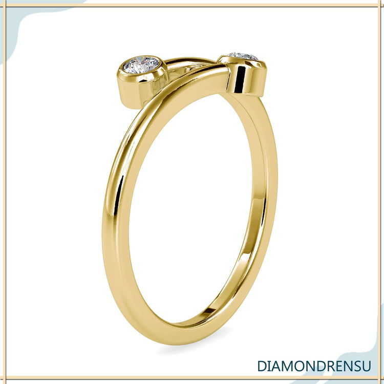 Bypass diamond band with two round cut lab stones.