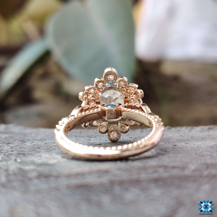 Custom engagement ring featuring rose gold moissanite.