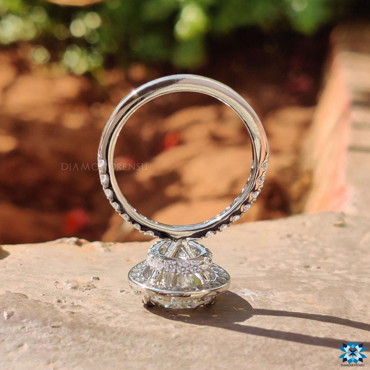 White gold ring with teardrop moissanite center.