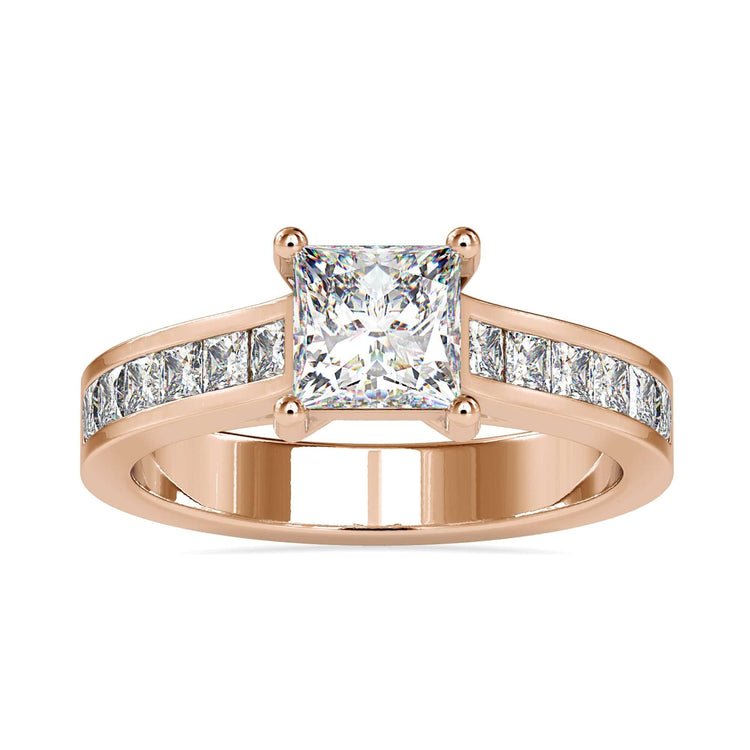 Designer ring with princess cut diamond and channel shoulders.