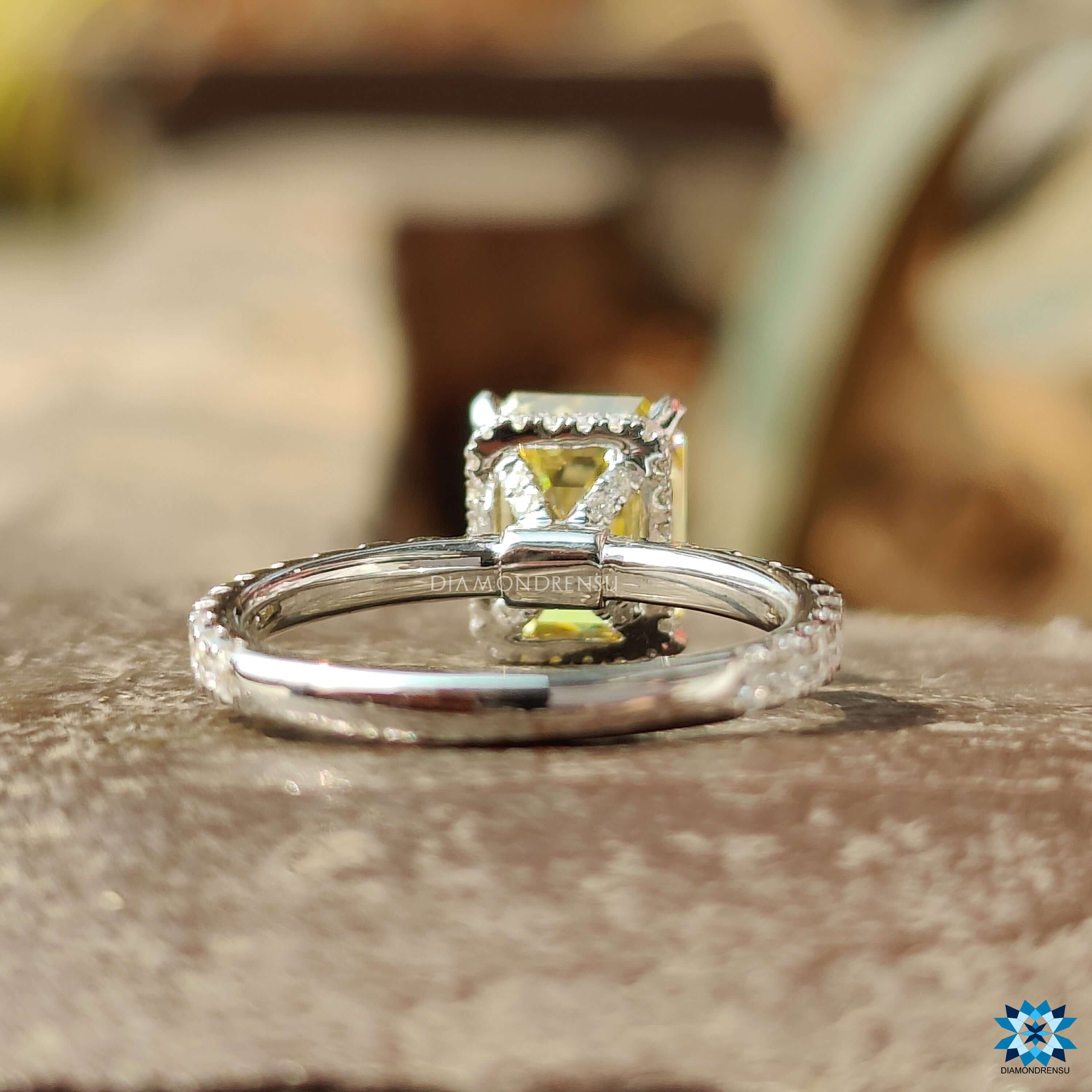 Handmade engagement ring with vibrant yellow moissanite center.