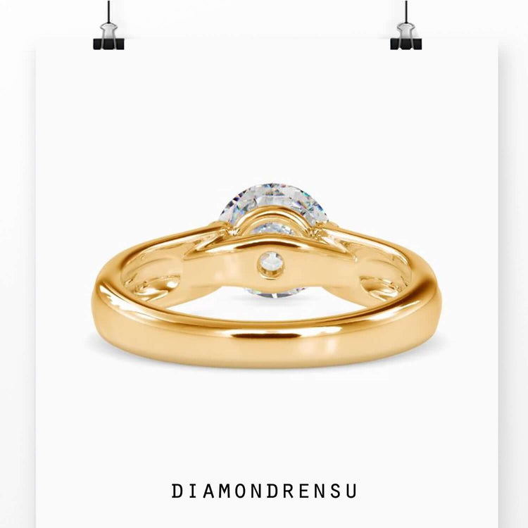 Yellow gold ring with lab grown diamond in tension set style.