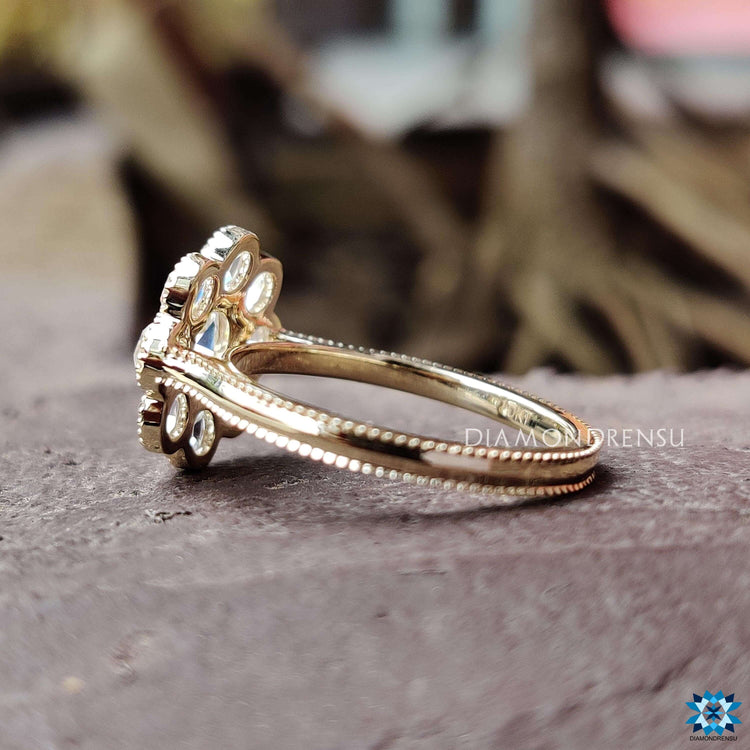 Handmade vintage ring with cluster halo and moissanite.