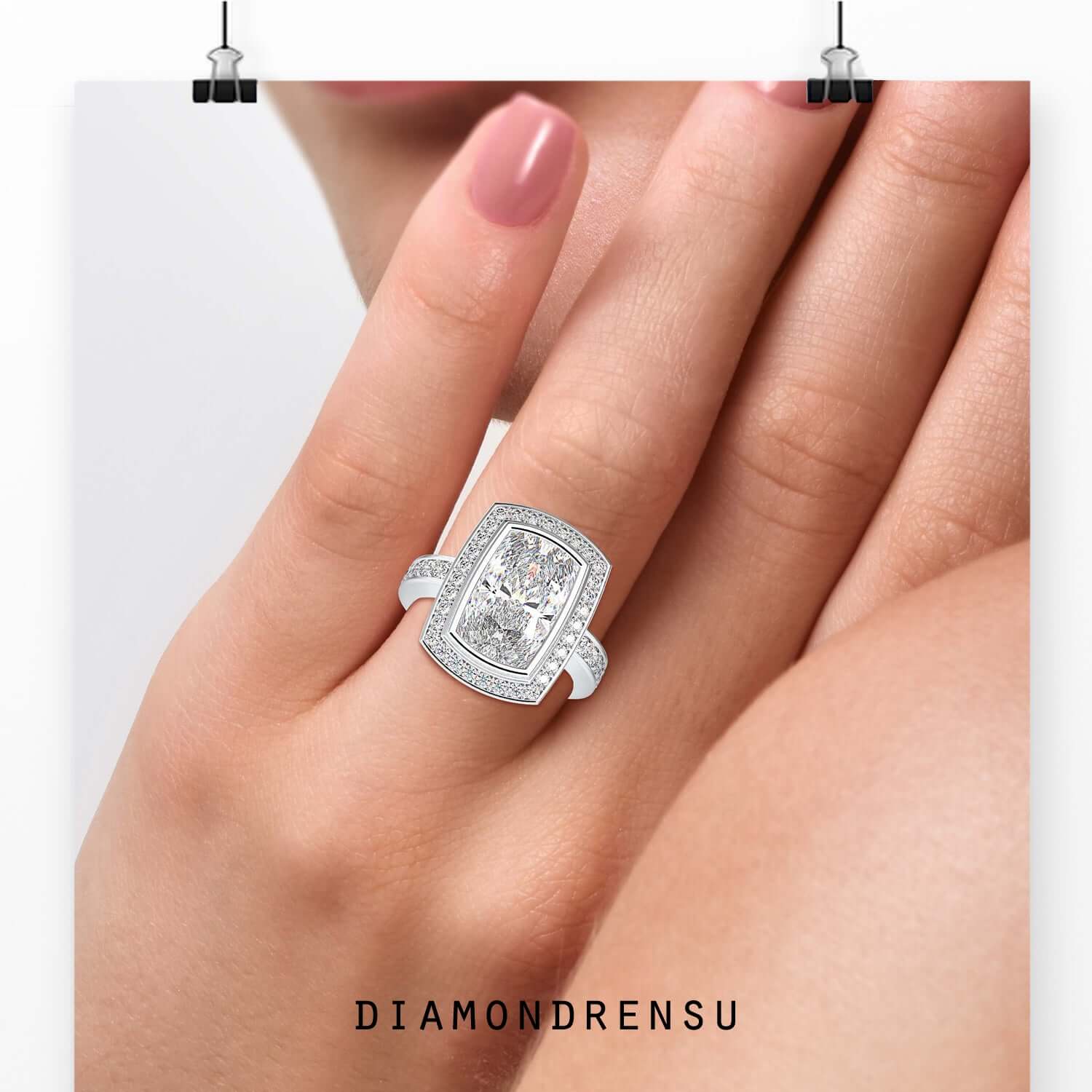 Halo engagement ring with cushion cut and pave band.