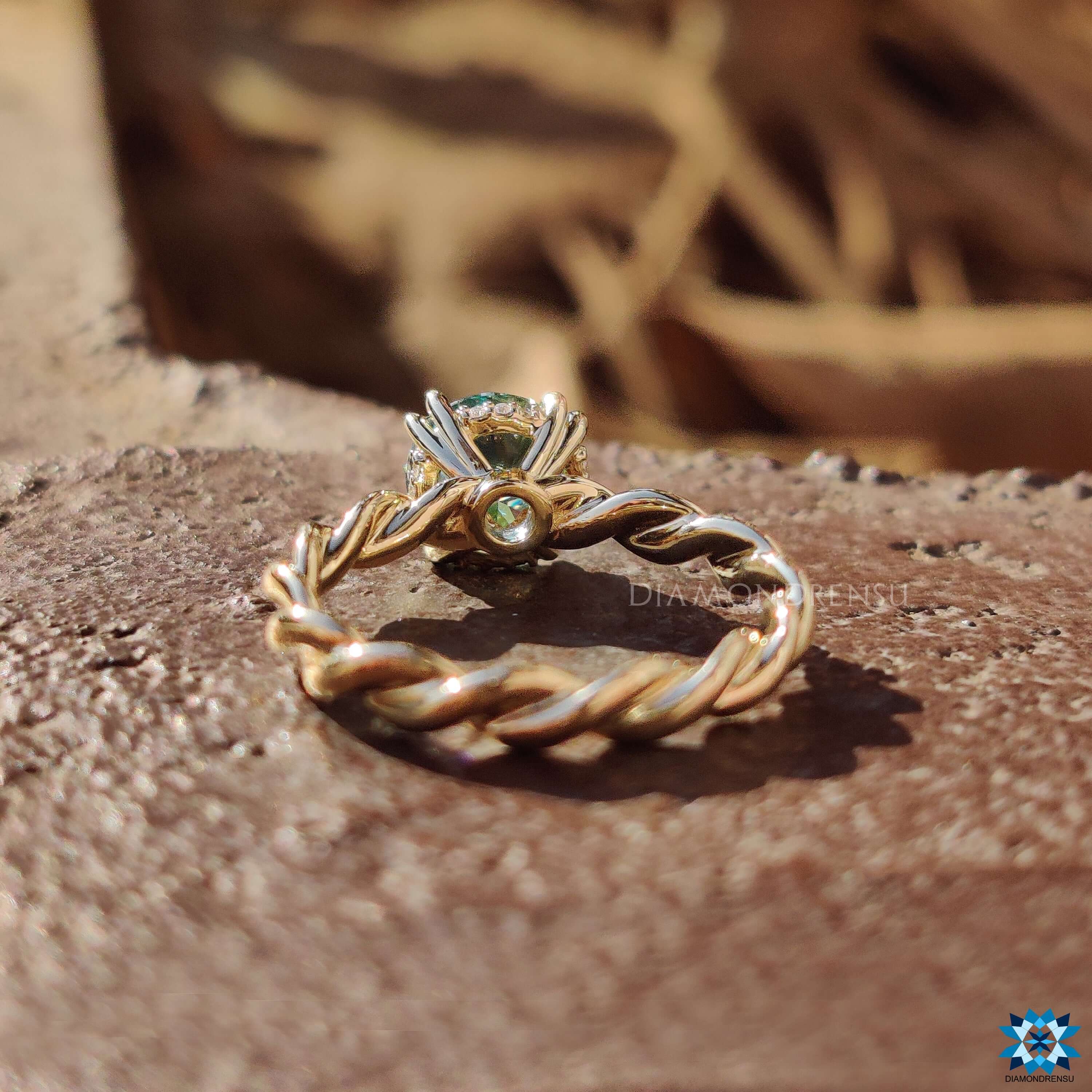 Handmade solitaire ring with double claw prong and hidden halo.