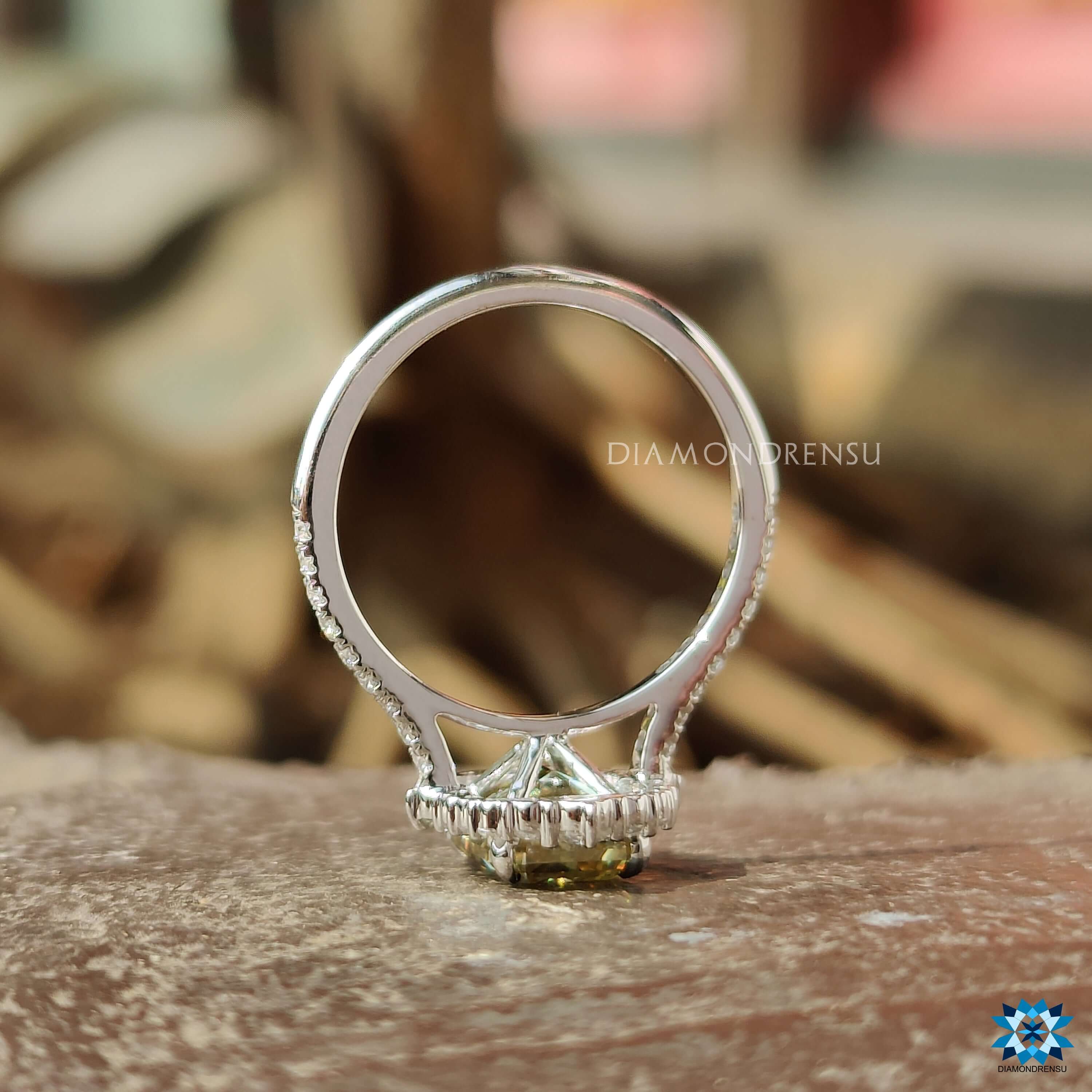 Handmade canary yellow moissanite ring with 4 prong setting.