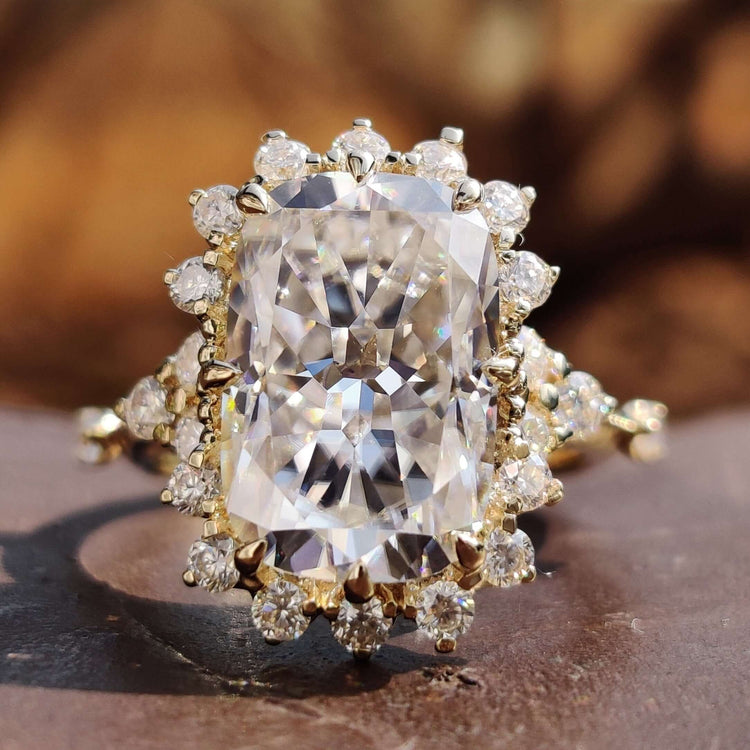 Cushion Rensu cut moissanite ring set in yellow gold.