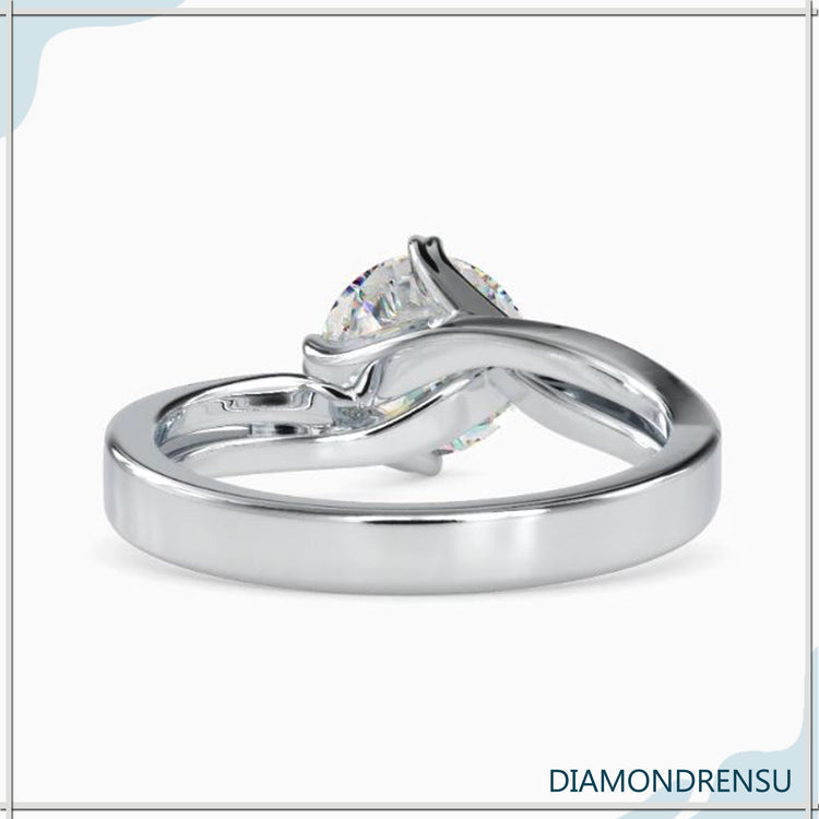 Custom engagement ring with rose gold twist and heart prong setting.
