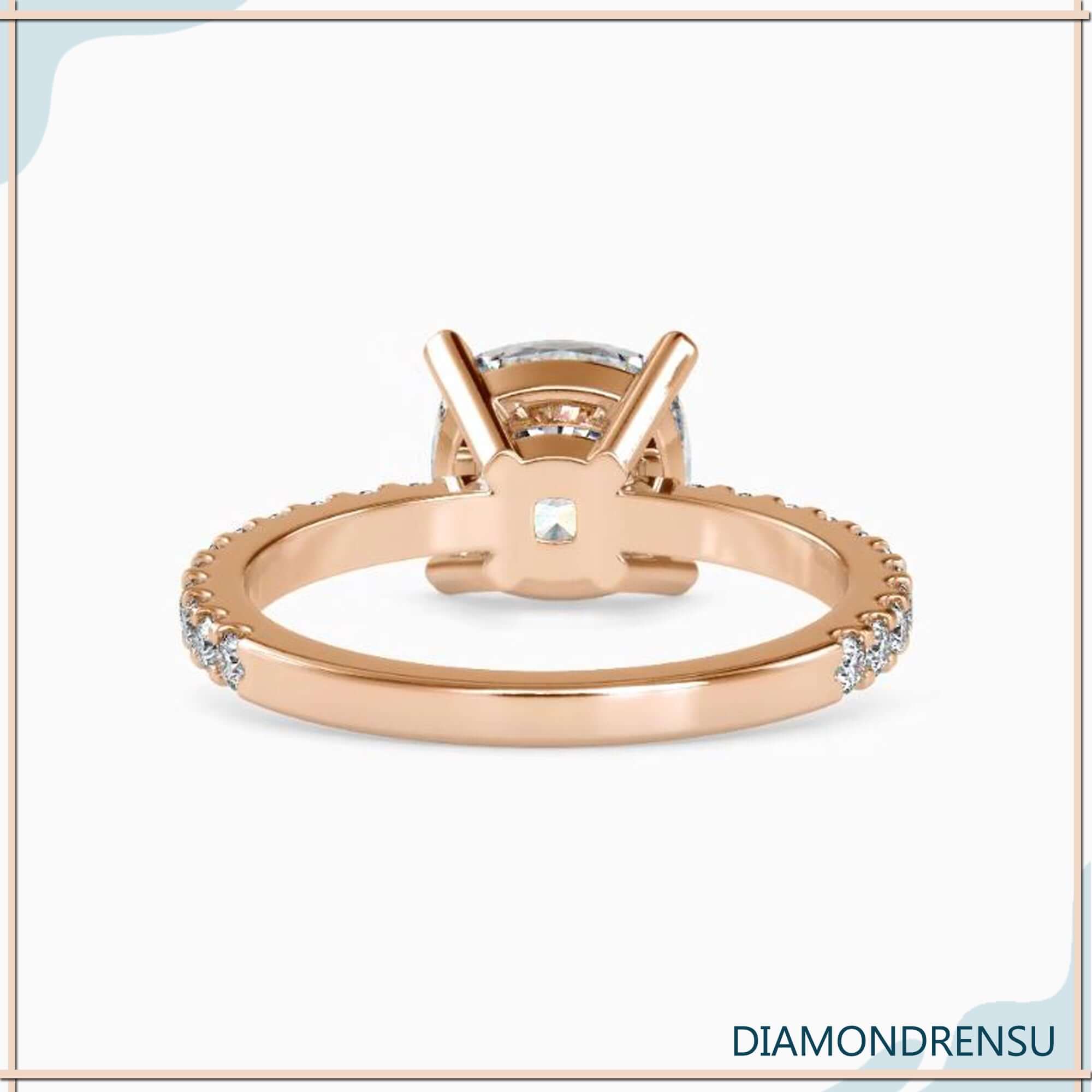 Lab diamond ring with round side stones and cushion centre.