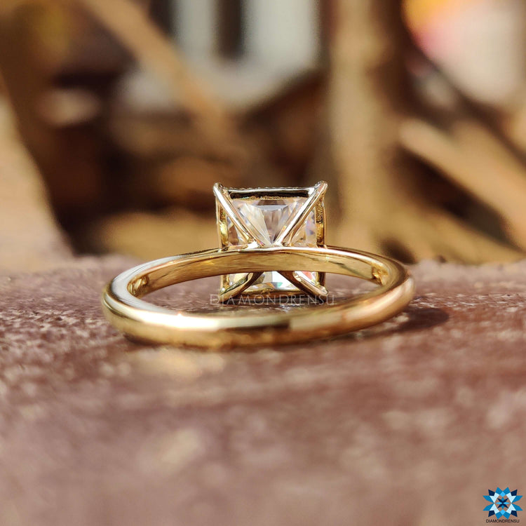 Handmade moissanite ring with a princess cut center stone and solitaire style.